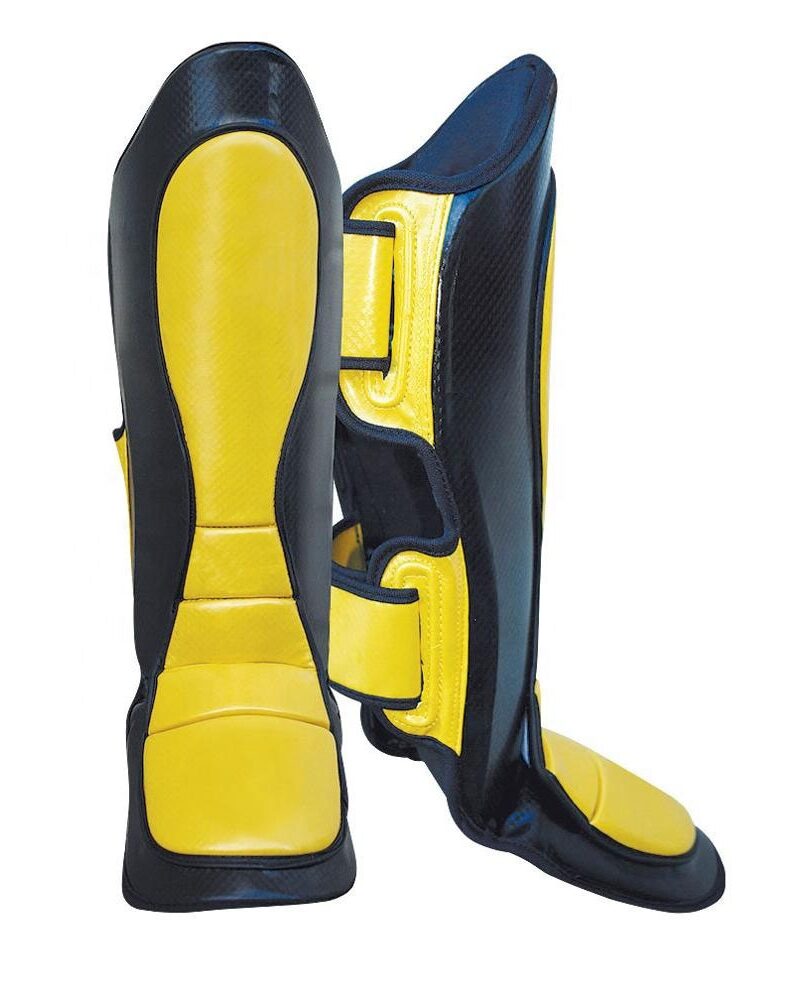 High-quality kickboxing shin instep guard in black and yellow, designed for maximum leg and foot protection during training and competitions.