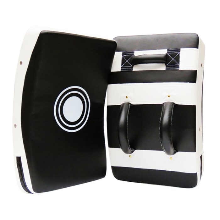 Black and white kicking shield for martial arts, kickboxing, and MMA training with ergonomic handles and target design.