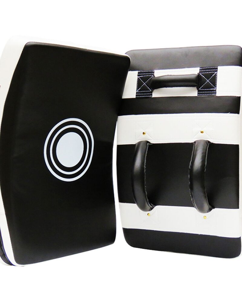 Black and white kicking shield for martial arts, kickboxing, and MMA training with ergonomic handles and target design.